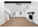 Inviting living room featuring a stylish fireplace and wood flooring at 630 Pennylake Ct, Stone Mountain, GA 30087