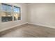 Bright bedroom featuring a large window allowing ample natural light at 7691 Brazos Trl, Fairburn, GA 30213