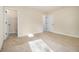 Bedroom with neutral walls, carpet, and a door leading to closet at 7691 Brazos Trl, Fairburn, GA 30213