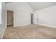 Bedroom with high ceilings, carpet, closet and a white door at 7691 Brazos Trl, Fairburn, GA 30213