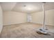 Large bonus room with neutral walls, carpet, and HVAC visible at 7691 Brazos Trl, Fairburn, GA 30213