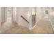 Upstairs hallway with carpeted floors, decorative trim, and natural light at 7691 Brazos Trl, Fairburn, GA 30213