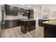 Modern kitchen with granite countertops, stainless steel appliances, and ample cabinet space at 7691 Brazos Trl, Fairburn, GA 30213