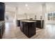 Modern kitchen with granite countertops, stainless steel appliances, and ample cabinet space at 7691 Brazos Trl, Fairburn, GA 30213