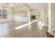 Spacious living room with hardwood floors, gas fireplace and plenty of natural light at 7691 Brazos Trl, Fairburn, GA 30213