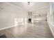 Bright, open-concept living space with wood floors and modern finishes at 7691 Brazos Trl, Fairburn, GA 30213
