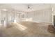 Open living area featuring decorative trim, carpet, and a stone fireplace at 7691 Brazos Trl, Fairburn, GA 30213