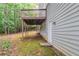 The home features a large backyard with a deck, mature trees, and lush greenery at 1790 Abinger Ln, Lawrenceville, GA 30043
