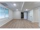 Finished basement featuring laminate floors, drop ceiling, and a window at 1790 Abinger Ln, Lawrenceville, GA 30043
