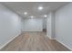 Finished basement with modern flooring, recessed lighting, and freshly painted walls at 1790 Abinger Ln, Lawrenceville, GA 30043