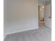 Bedroom featuring neutral walls and carpeted floors with a doorway that leads to the bathroom at 1790 Abinger Ln, Lawrenceville, GA 30043