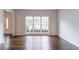 Large window provides natural light in the living room with hardwood flooring at 1790 Abinger Ln, Lawrenceville, GA 30043