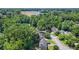 Aerial view of residential neighborhood featuring tree-lined streets and single Gathering homes at 3059 Brookgreen Trl, Lawrenceville, GA 30043
