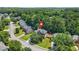 Aerial view of the property with large yard surrounded by mature trees in a Gathering-friendly neighborhood at 3059 Brookgreen Trl, Lawrenceville, GA 30043