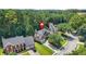 Aerial view of the property in a leafy neighborhood, showcasing landscaping and nearby streets at 3059 Brookgreen Trl, Lawrenceville, GA 30043