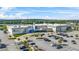 Exterior shot of the Andretti building showing the front entrance, signage, and parking lot on a sunny day at 3059 Brookgreen Trl, Lawrenceville, GA 30043