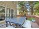 Deck area featuring a table, chairs, and a bench at 3059 Brookgreen Trl, Lawrenceville, GA 30043
