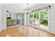 Bright dining room with hardwood floors and large windows offering a view to the outdoor deck and backyard at 3059 Brookgreen Trl, Lawrenceville, GA 30043