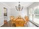 Dining room features a chandelier, hardwood floors and windows for a bright, inviting space at 3059 Brookgreen Trl, Lawrenceville, GA 30043