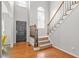 Bright foyer features hardwood floors, staircase, and an abundance of natural light at 3059 Brookgreen Trl, Lawrenceville, GA 30043