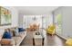 Open living room and dining area with lots of natural light, neutral tones and comfortable furnishings at 3059 Brookgreen Trl, Lawrenceville, GA 30043