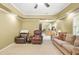 Open living room with comfortable seating and neutral carpeting at 3059 Brookgreen Trl, Lawrenceville, GA 30043