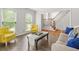 Cozy living room with two sunny windows, couch and decorative accessories for relaxing and entertaining at 3059 Brookgreen Trl, Lawrenceville, GA 30043