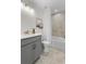 Neat bathroom featuring a single sink vanity, tiled shower and flooring at 4317 Azalea Ridge Way, Hoschton, GA 30548