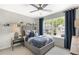 Well-lit bedroom featuring neutral walls, a ceiling fan, and bright natural light at 4317 Azalea Ridge Way, Hoschton, GA 30548