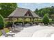 Pool-side gazebo with seating and lounge chairs for relaxing and enjoying the outdoor area at 4317 Azalea Ridge Way, Hoschton, GA 30548