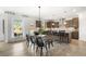 Spacious kitchen with a center island, bar seating, and stainless steel appliances at 4317 Azalea Ridge Way, Hoschton, GA 30548