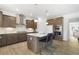 Modern kitchen with a large island, stainless steel appliances, and ample cabinet space at 4317 Azalea Ridge Way, Hoschton, GA 30548