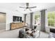 Upstairs loft area with a large window and entertainment area at 4317 Azalea Ridge Way, Hoschton, GA 30548