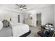 Bright main bedroom with neutral tones and plush bedding, complemented by an ensuite bathroom entrance at 4317 Azalea Ridge Way, Hoschton, GA 30548