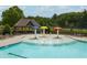 Community pool featuring a splash pad, beach entry, shade gazebo, and lounge chairs at 4317 Azalea Ridge Way, Hoschton, GA 30548