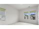 Bright bedroom with large windows offering neighborhood views at 779 Keystone Dr, Woodstock, GA 30188
