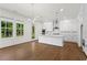 Bright kitchen with hardwood floors, a large island, and stainless steel appliances at 779 Keystone Dr, Woodstock, GA 30188