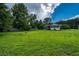 A large backyard featuring a home with both brick and vinyl siding at 1997 Villa Rica Hwy, Dallas, GA 30157