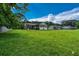 A large grassy backyard with a home featuring both brick and vinyl siding at 1997 Villa Rica Hwy, Dallas, GA 30157