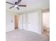 This is a bedroom with fresh paint, neutral carpet, a ceiling fan, window, and closet at 1997 Villa Rica Hwy, Dallas, GA 30157