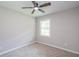 Neutral bedroom with a carpeted floor, lit ceiling fan, and window offering a serene and comfortable atmosphere at 1997 Villa Rica Hwy, Dallas, GA 30157