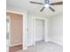 Bedroom featuring bi-fold doors leading to the closet with carpeted flooring and neutral paint color throughout the room at 1997 Villa Rica Hwy, Dallas, GA 30157