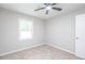 Bedroom featuring a window view, an open closet for storage, and a neutral color scheme for a relaxing ambiance at 1997 Villa Rica Hwy, Dallas, GA 30157