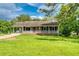 Charming single-story home with a covered porch and well-maintained front yard at 1997 Villa Rica Hwy, Dallas, GA 30157