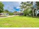 A cozy single-story home featuring a covered porch and a lush green lawn at 1997 Villa Rica Hwy, Dallas, GA 30157