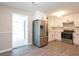 Modern kitchen with stainless steel appliances, white cabinets and updated floors at 1997 Villa Rica Hwy, Dallas, GA 30157