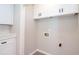 Laundry room with cabinets and hookups for washer and dryer at 1997 Villa Rica Hwy, Dallas, GA 30157