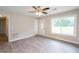 Bright living room featuring new floors, fresh paint, and a ceiling fan at 1997 Villa Rica Hwy, Dallas, GA 30157