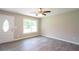Bright living room featuring new floors, fresh paint, a ceiling fan and natural light at 1997 Villa Rica Hwy, Dallas, GA 30157