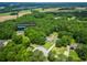 Overhead view of the property including the home, surrounded by mature trees and expansive green spaces at 2680 Bay Ridge Dr, Loganville, GA 30052